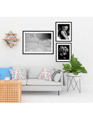 A poster with a windmill on a background of clouds. Black and white graphics for the frame ideal for a modern interior. A poster with a windmill on a background of clouds. Black and white graphics for the frame ideal for a modern interior.